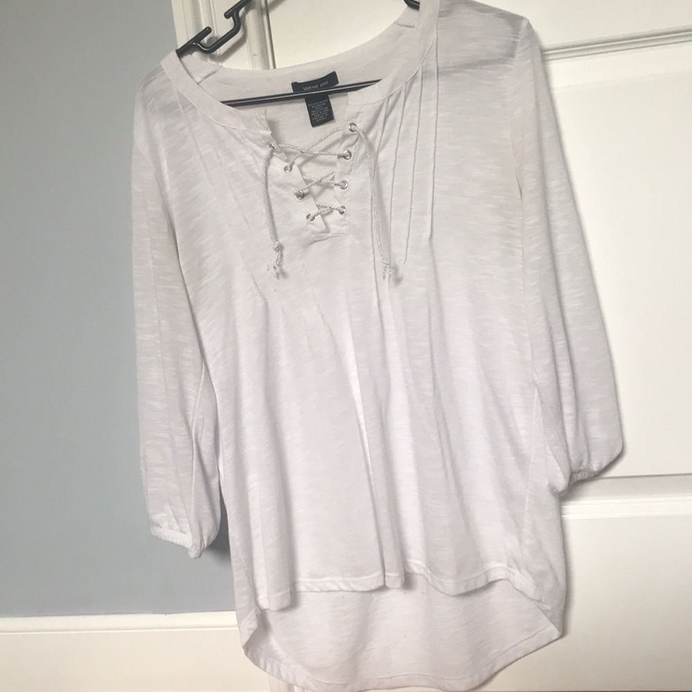 A white flowy high low with a V-neck cut out